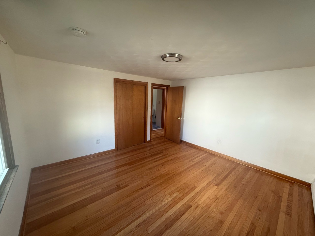 Main-level bedroom in Floor 1 apartment; room number unassigned