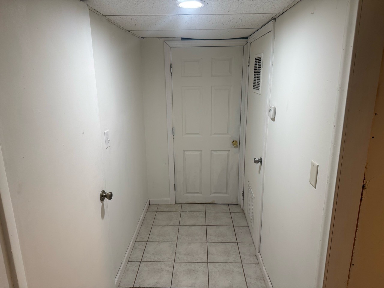 Approved basement entrance & hallway photo for Floor 1 apartment